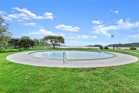 a picture of a bench in front of a wall