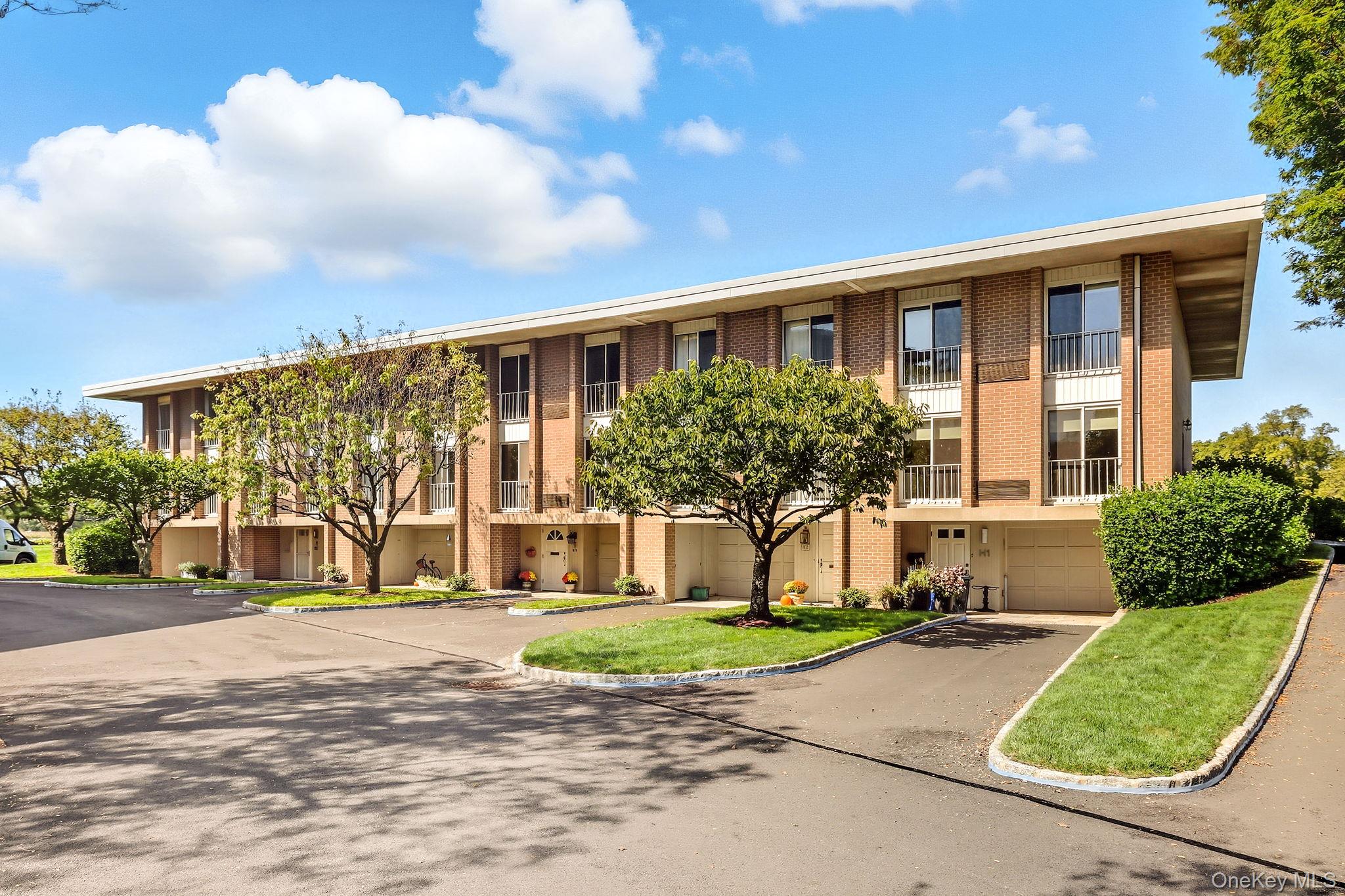 720 Milton Road, Unit H3 Rye, NY 10580 - Photo 3 of 27 a front view of a house with a yard