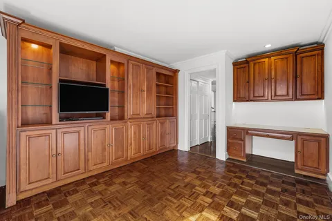 a living room with fireplace furniture and a flat screen tv