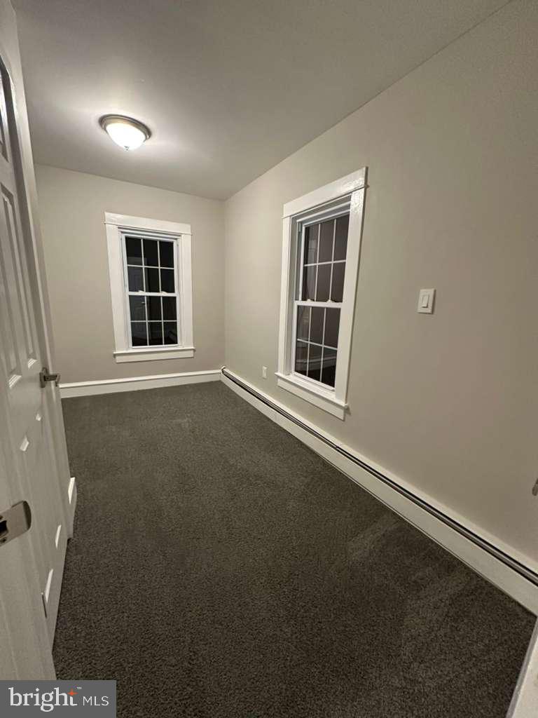 220 Berlin Road Clementon, NJ 08021 - Photo 11 of 15 a view of an empty room with a window