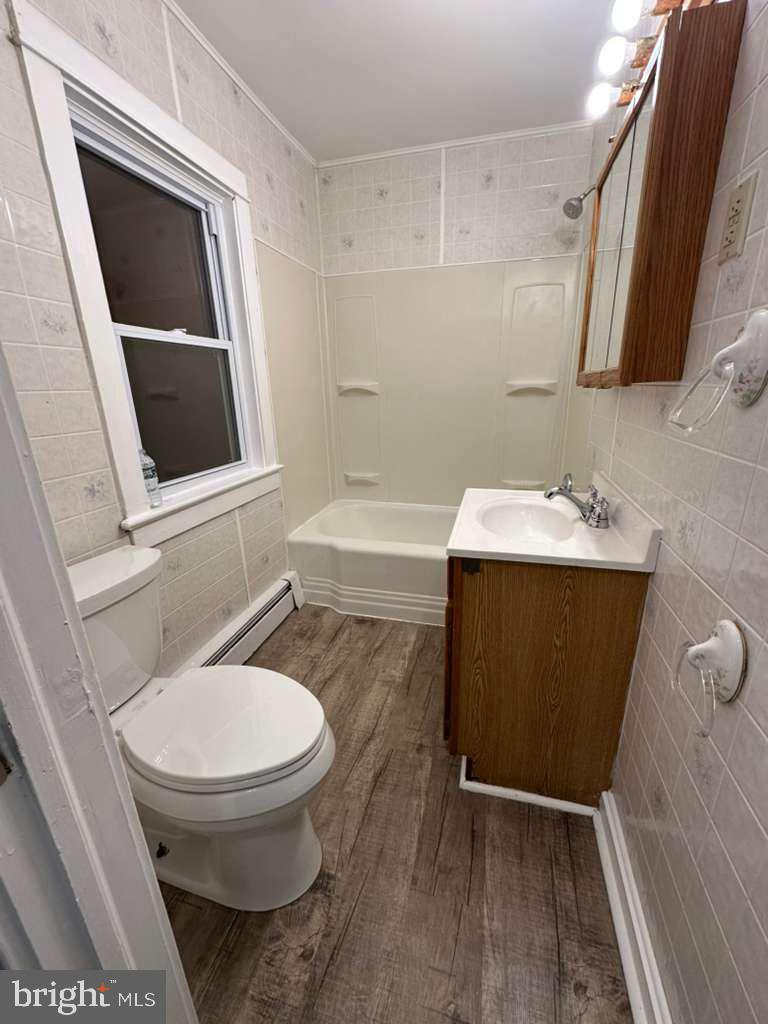220 Berlin Road Clementon, NJ 08021 - Photo 12 of 15 a bathroom with a sink toilet and shower