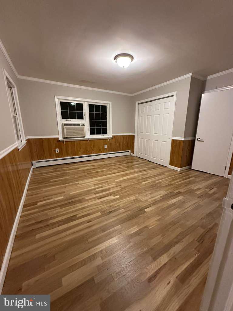 220 Berlin Road Clementon, NJ 08021 - Photo 4 of 15 a view of empty room with wooden floor