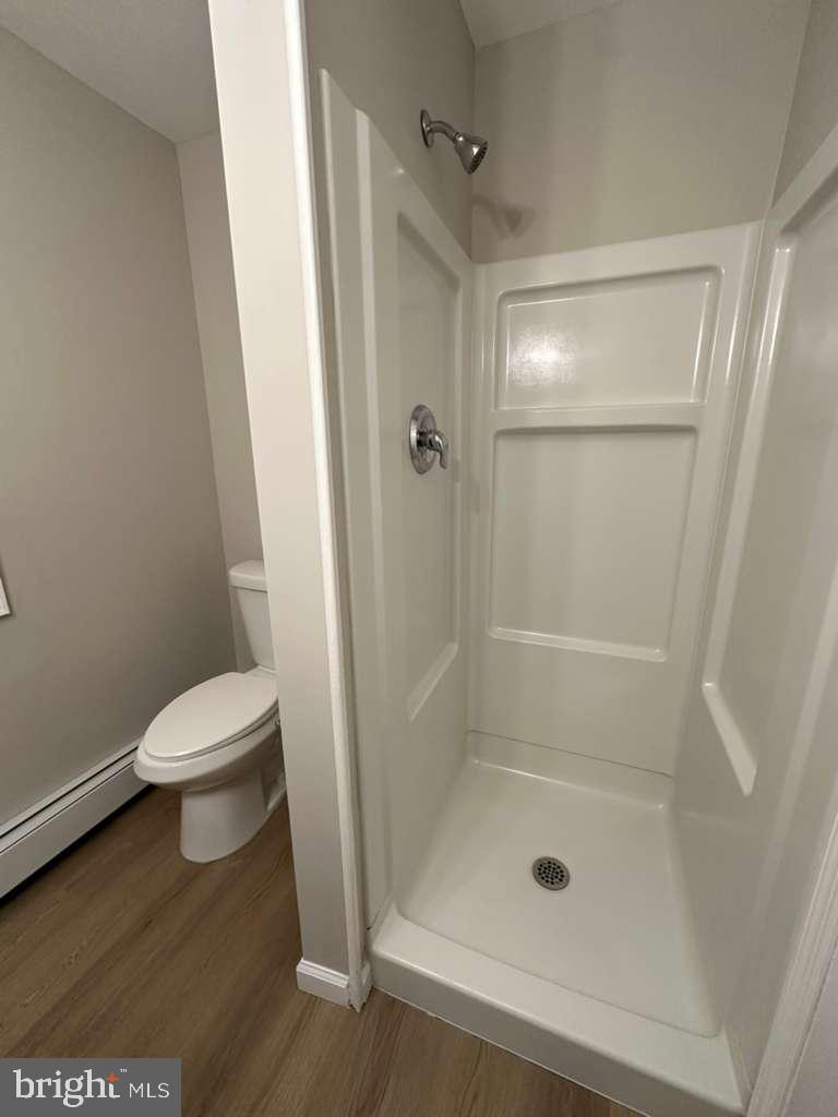 220 Berlin Road Clementon, NJ 08021 - Photo 10 of 15 a bathroom with a shower and a toilet