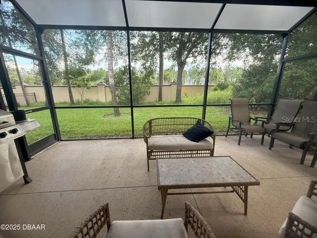 a reading room with furniture and outdoor view