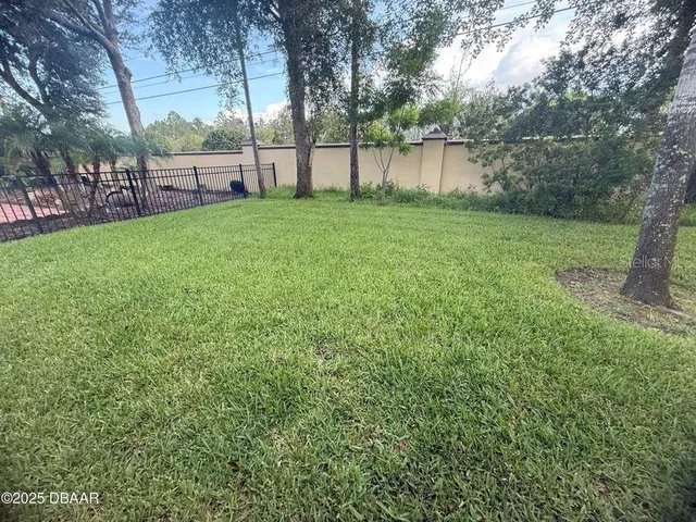 a view of a backyard with a small cabin