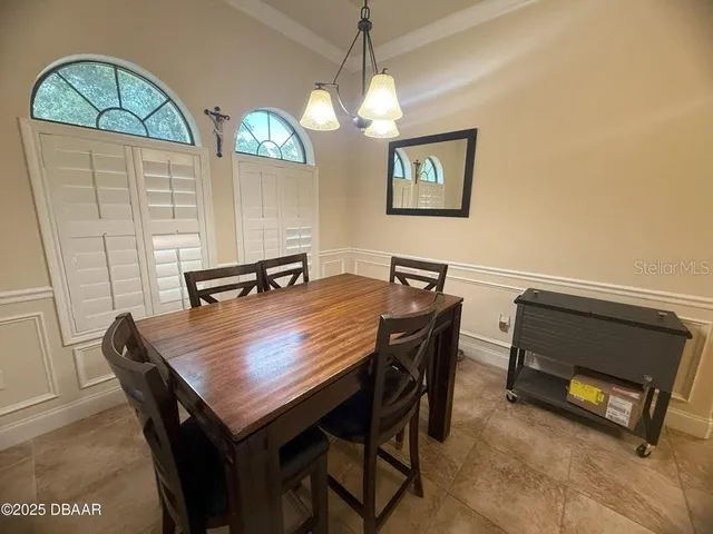 a view of a dining table and chairs in the room