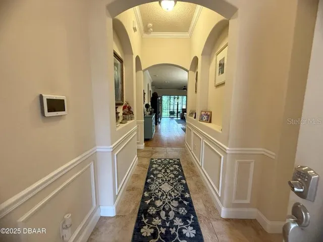a view of a hallway view with staircase