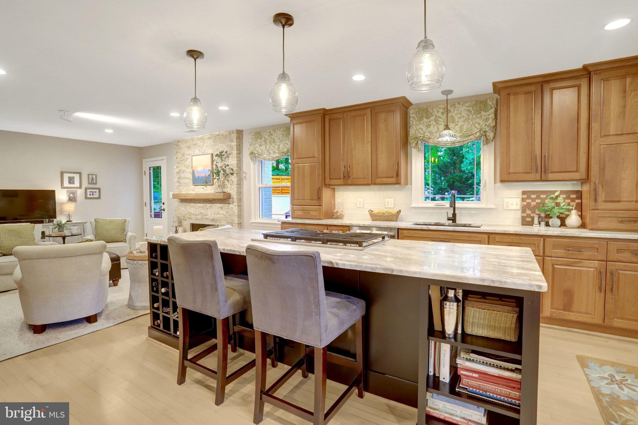7506 Oriole Avenue Springfield, VA 22150 - Photo 15 of 67 a kitchen with a table chairs sink and cabinets