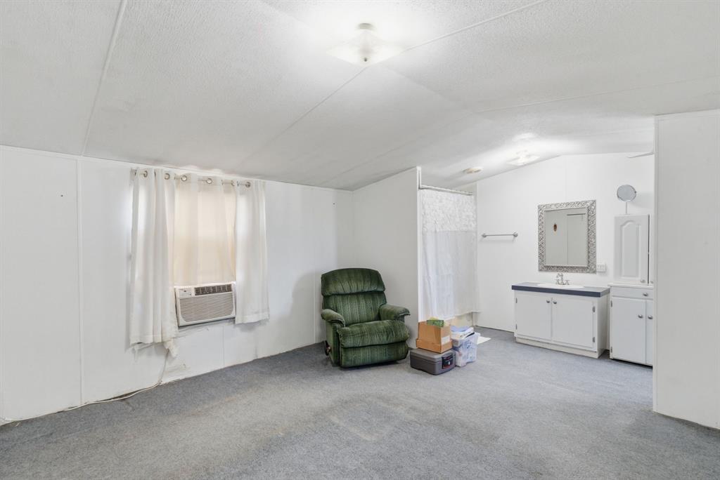 144 Oak Meadows Drive Springtown, TX 76082 - Photo 11 of 24 a room with furniture and window