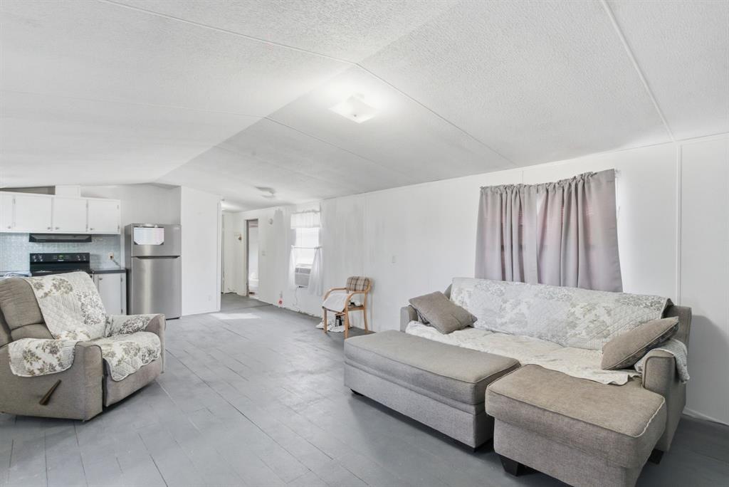 144 Oak Meadows Drive Springtown, TX 76082 - Photo 14 of 24 a living room with furniture and a couch
