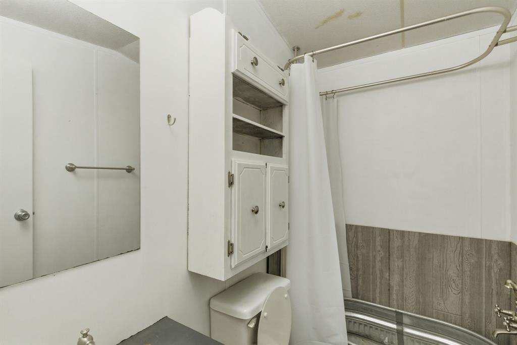 144 Oak Meadows Drive Springtown, TX 76082 - Photo 15 of 24 a bathroom with a shower and a sink