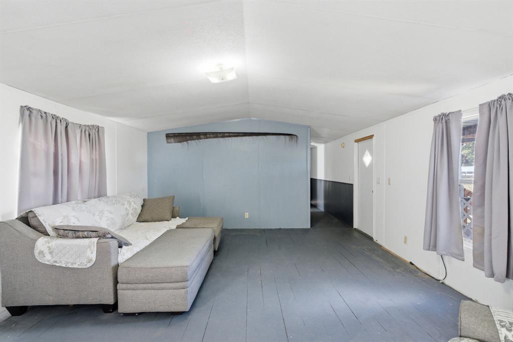 144 Oak Meadows Drive Springtown, TX 76082 - Photo 20 of 24 a living room with furniture and a walk in closet