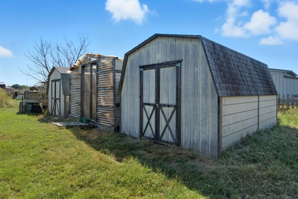 144 Oak Meadows Drive Springtown, TX 76082 - Photo 23 of 24 a front view of a house with garden