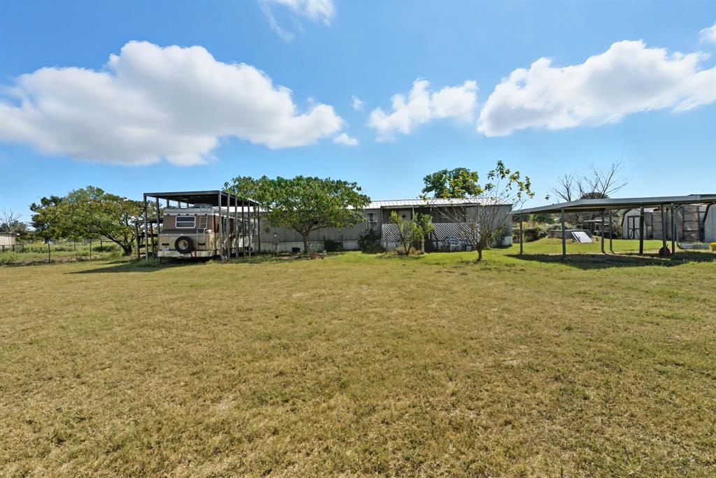 144 Oak Meadows Drive Springtown, TX 76082 - Photo 3 of 24 a view of a lake with houses