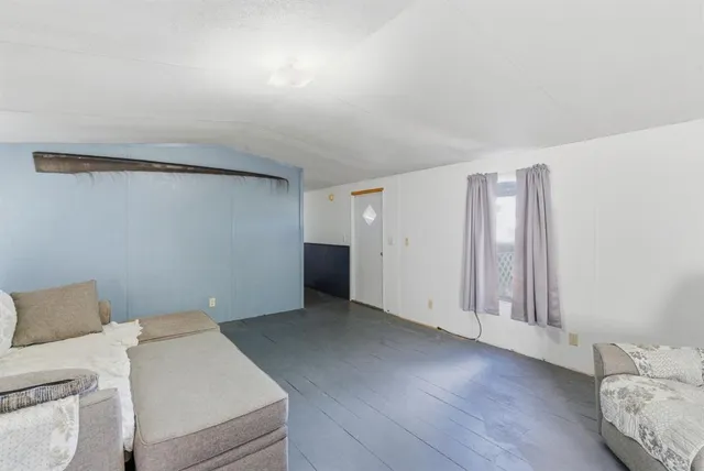 a view of livingroom with furniture and wooden floor