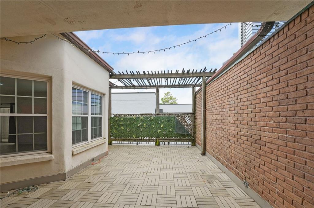 3649 Peachtree Road Northeast, Unit 305 Atlanta, GA 30319 - Photo 17 of 58 a view of a porch with a floor to ceiling windows
