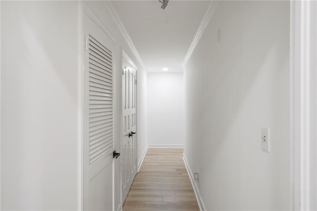 3649 Peachtree Road Northeast, Unit 305 Atlanta, GA 30319 - Photo 20 of 58 a view of a hallway with a white walls