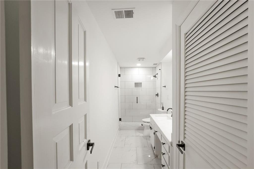 3649 Peachtree Road Northeast, Unit 305 Atlanta, GA 30319 - Photo 23 of 58 a bathroom with a shower