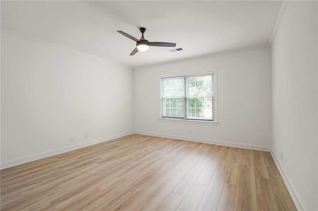 3649 Peachtree Road Northeast, Unit 305 Atlanta, GA 30319 - Photo 38 of 58 wooden floor in an empty room with a window