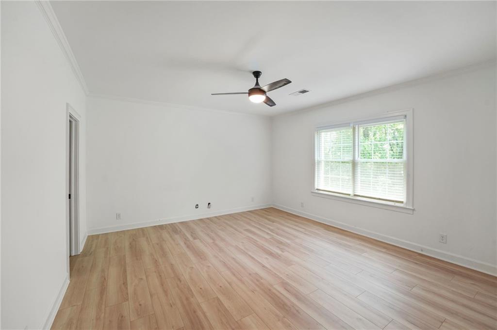 3649 Peachtree Road Northeast, Unit 305 Atlanta, GA 30319 - Photo 47 of 58 wooden floor in an empty room with a window