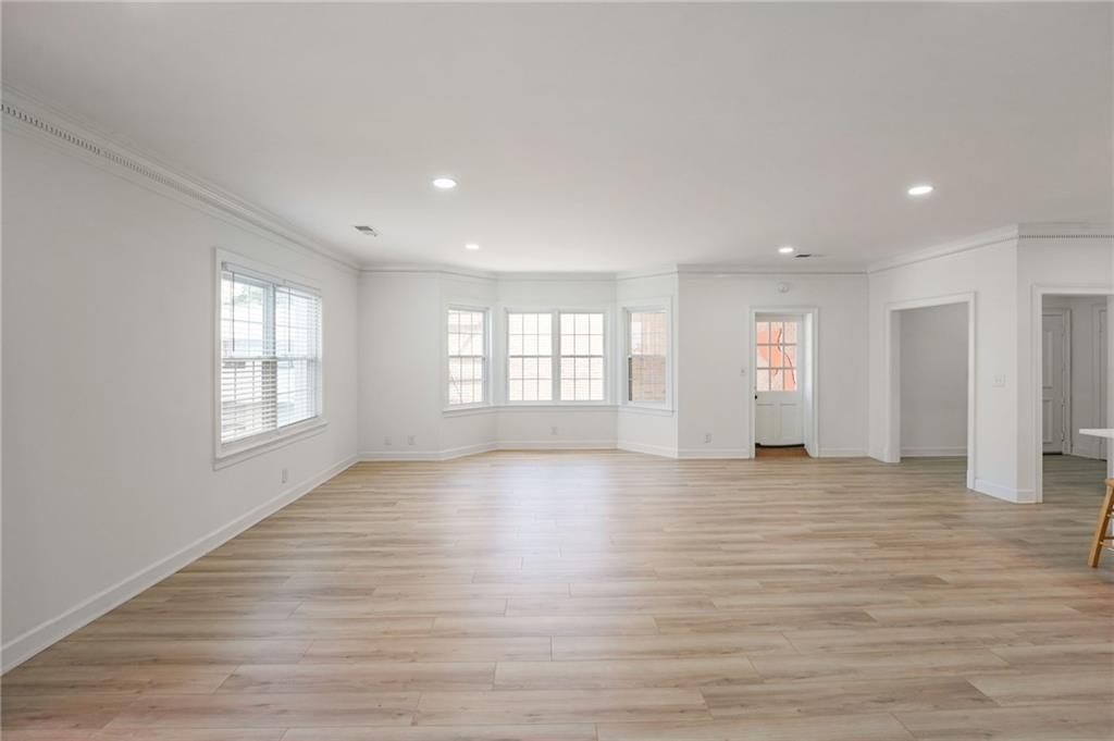 3649 Peachtree Road Northeast, Unit 305 Atlanta, GA 30319 - Photo 50 of 58 a view of an empty room with wooden floor and window