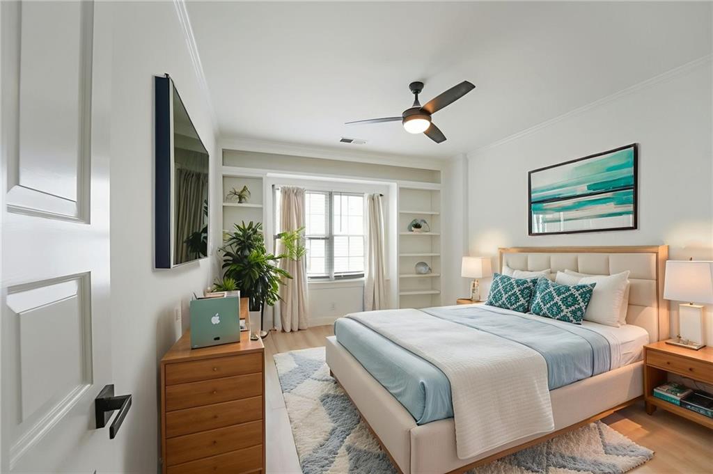 3649 Peachtree Road Northeast, Unit 305 Atlanta, GA 30319 - Photo 5 of 58 a bedroom with a large bed and windows