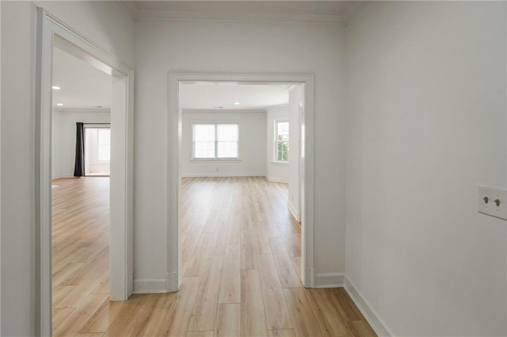 3649 Peachtree Road Northeast, Unit 305 Atlanta, GA 30319 - Photo 51 of 58 a view of a room with wooden floor and a bathroom