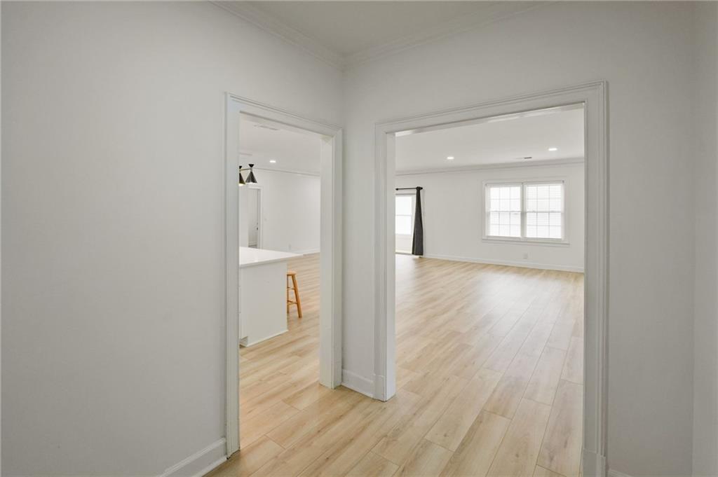 3649 Peachtree Road Northeast, Unit 305 Atlanta, GA 30319 - Photo 52 of 58 an empty room with wooden floor and a window