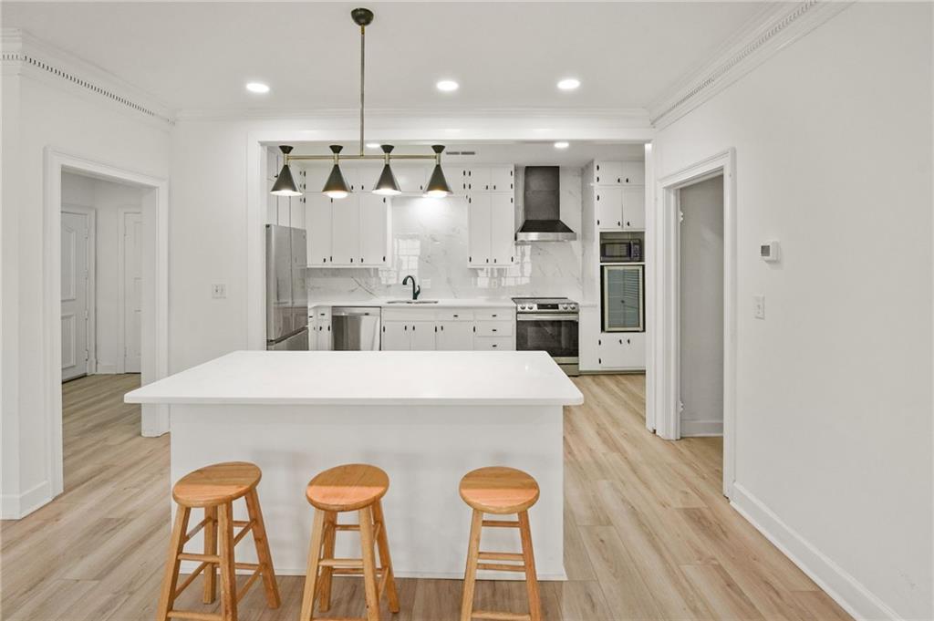 3649 Peachtree Road Northeast, Unit 305 Atlanta, GA 30319 - Photo 56 of 58 a large kitchen with a table and chairs
