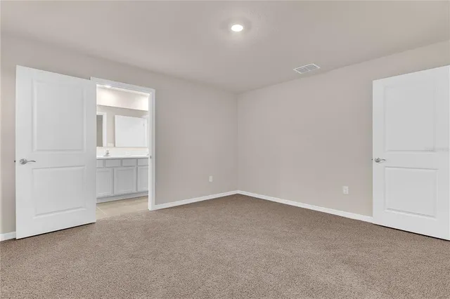 an empty room with a empty space and windows