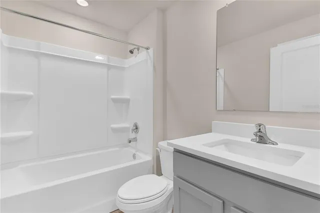 a bathroom with a sink a toilet and a bathtub