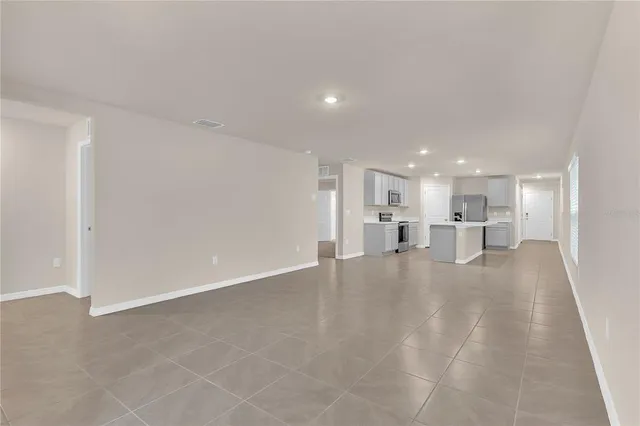 a view of a kitchen with a sink and cabinets