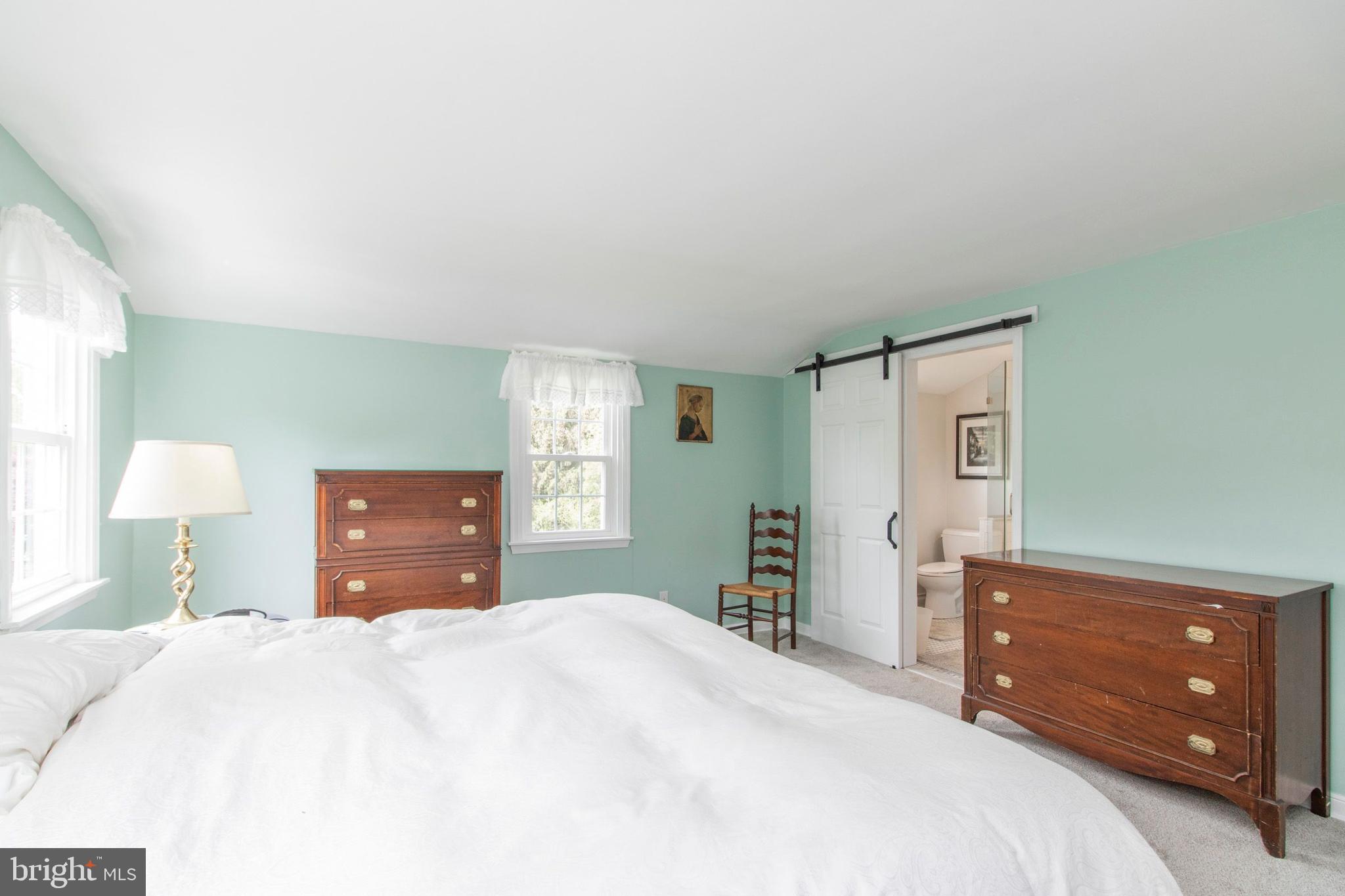 902 Preston Road Glenside, PA 19038 - Photo 27 of 34 Primary bedroom to ensuite with barn door