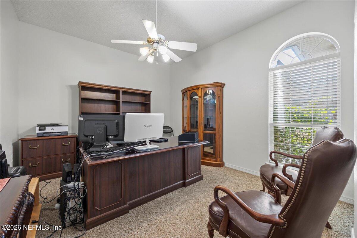 9750 Brockham Court Jacksonville, FL 32221 - Photo 11 of 39 a view of a workspace with furniture and a window
