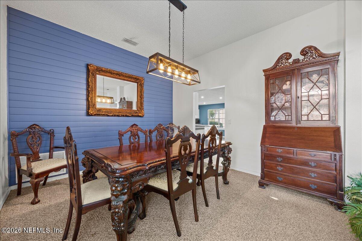 9750 Brockham Court Jacksonville, FL 32221 - Photo 20 of 39 a dining room with furniture and window