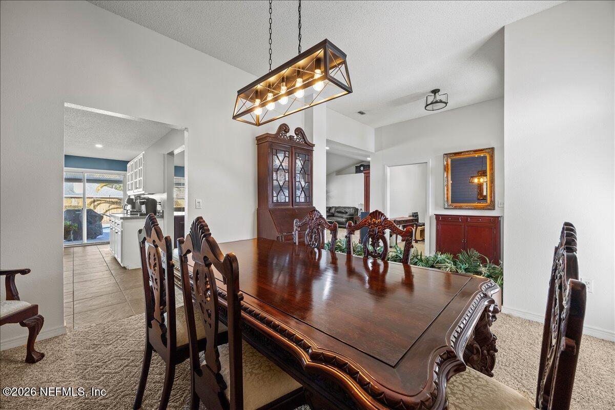 9750 Brockham Court Jacksonville, FL 32221 - Photo 22 of 39 a dining room with furniture and window