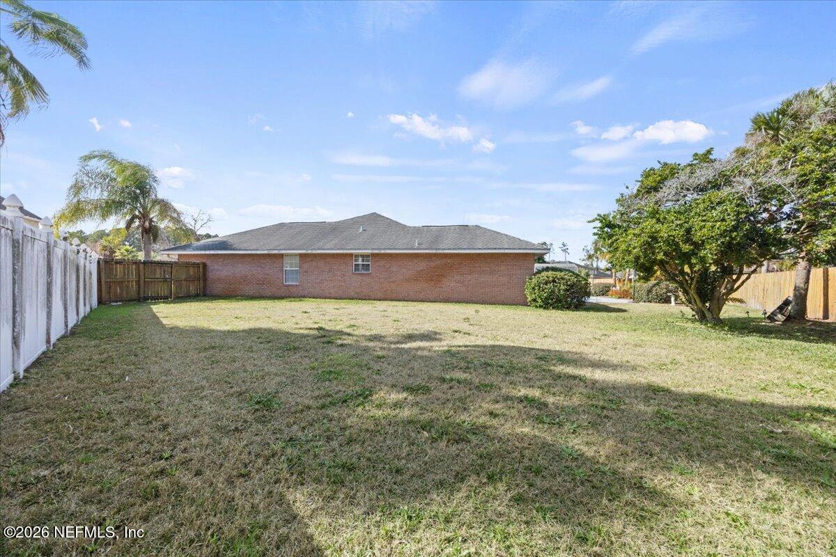 9750 Brockham Court Jacksonville, FL 32221 - Photo 39 of 39 a view of an outdoor space and a yard