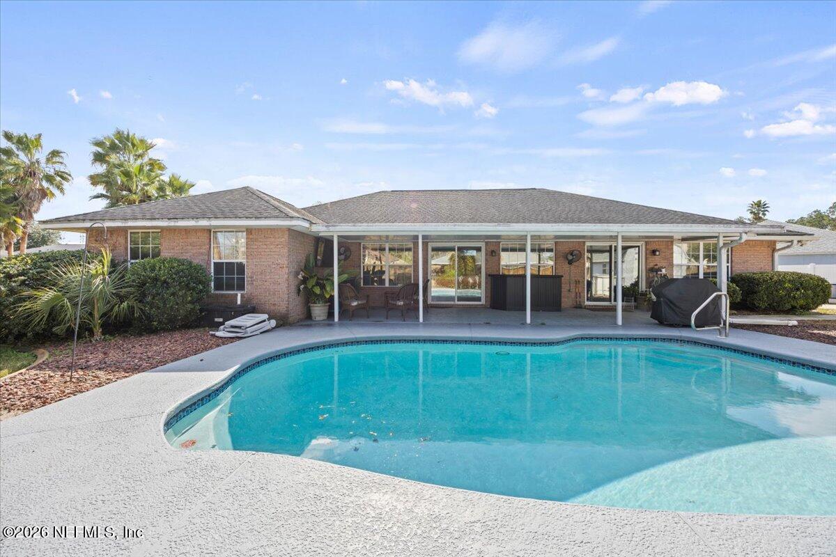 9750 Brockham Court Jacksonville, FL 32221 - Photo 5 of 39 a view of a house with swimming pool