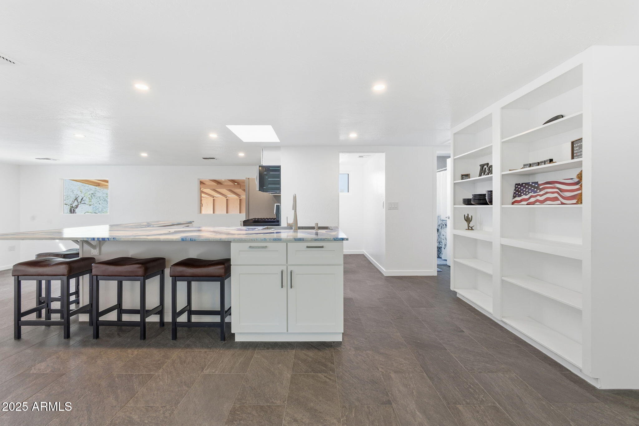 36975 North Sunset Trail Cave Creek, AZ 85331 - Photo 14 of 26 a kitchen with white cabinets and chairs