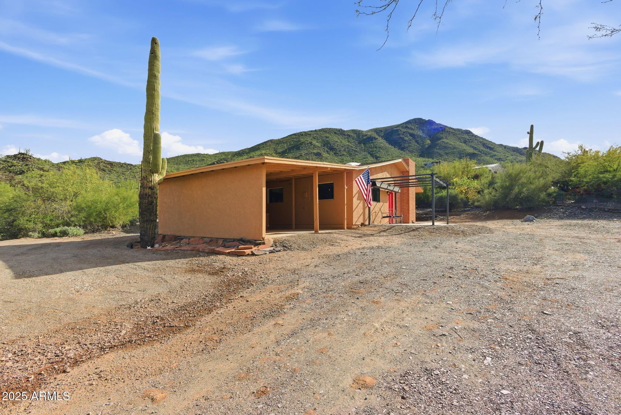 36975 North Sunset Trail Cave Creek, AZ 85331 - Photo 22 of 26 a front view of a house with a yard and garage
