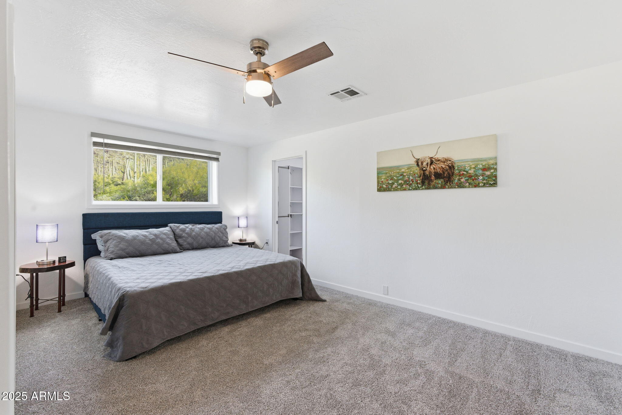 36975 North Sunset Trail Cave Creek, AZ 85331 - Photo 5 of 26 a bedroom with a bed painting on the wall and a window