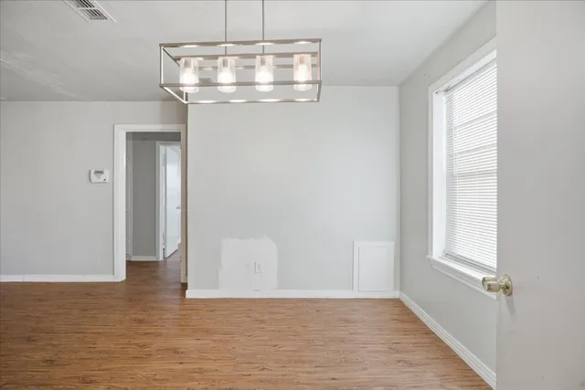 a view of a hallway with a window