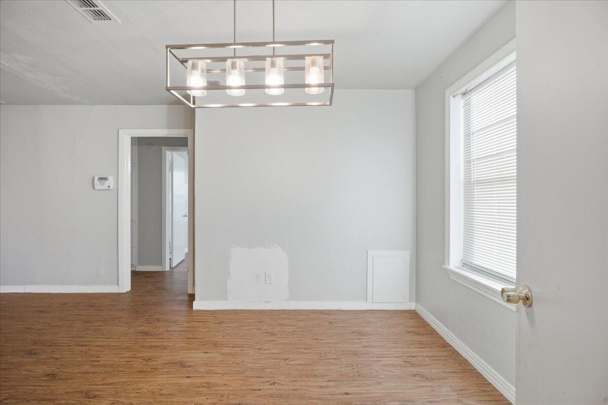4115 31st Street Lubbock, TX 79410 - Photo 5 of 16 a view of a hallway with a window