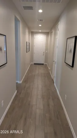 a view of hallway with an empty room