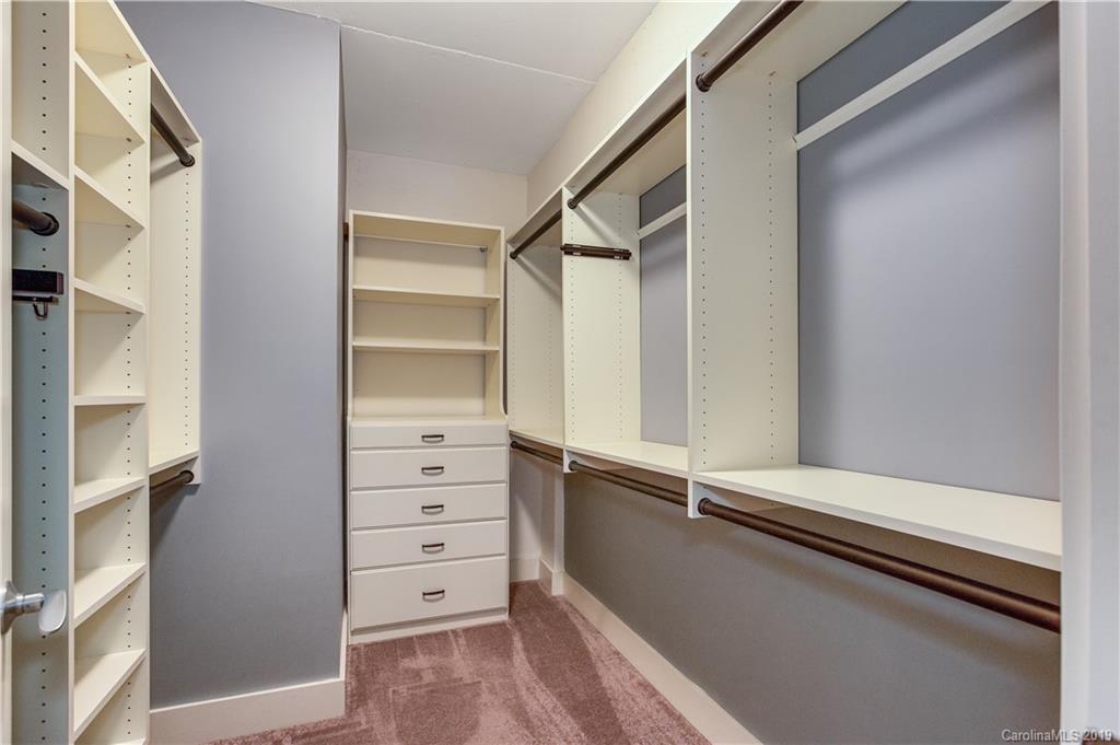 715 North Graham Street, Unit 210 Charlotte, NC 28202 - Photo 11 of 17 a view of walk in closet with empty racks