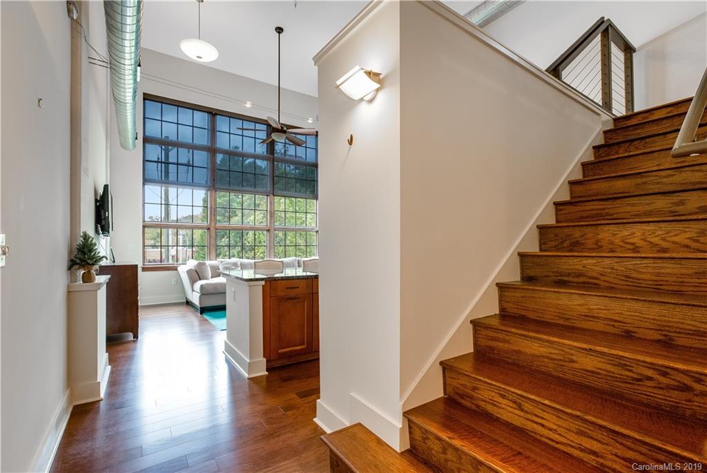 715 North Graham Street, Unit 210 Charlotte, NC 28202 - Photo 6 of 17 a view of entryway and hall with wooden floor