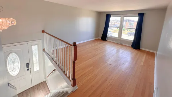 a view of an entryway with wooden floor
