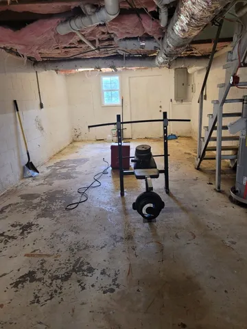 a front view of house with yard seating and green space