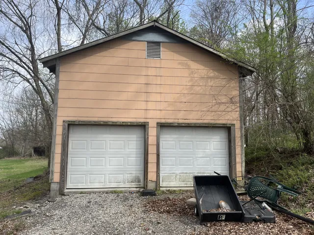 a view of a yard with a tree