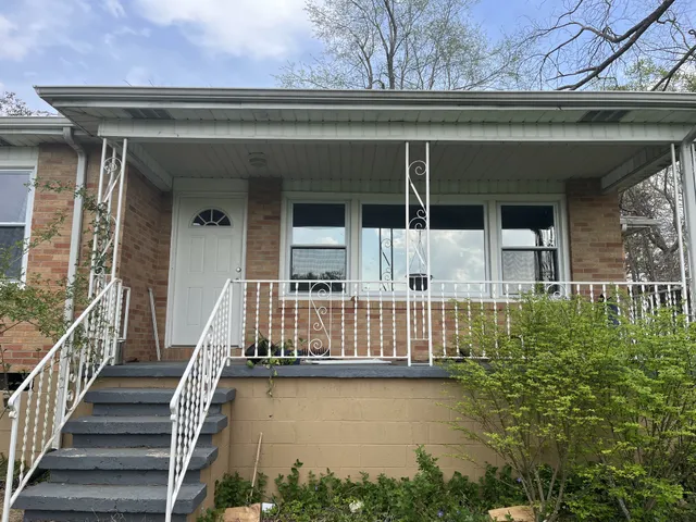 a view of a house with wooden floor and a window